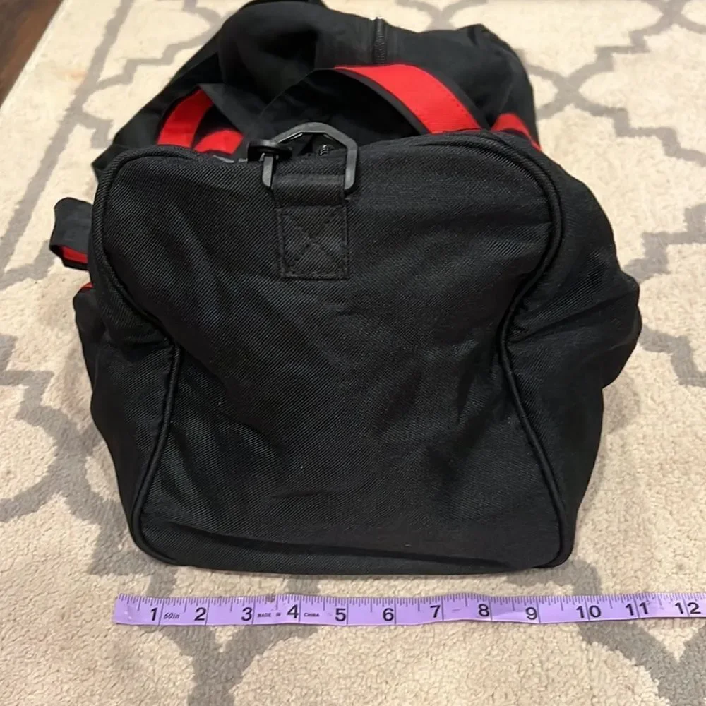 True Religion Black and Red Strap Duffel Bag
